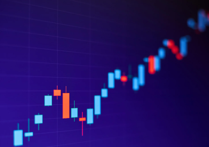Investor analyzing financial charts and economic reports while separating market signals from noise to make informed investment decisions