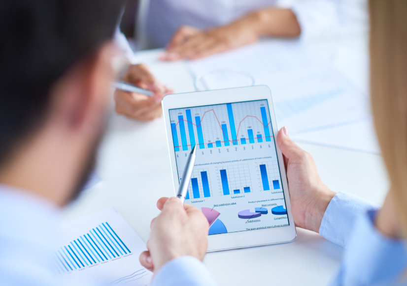 Investor using a minimalist financial data strategy with focused charts and essential market information for smarter investment decisions